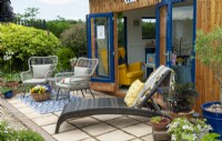 Garden studio with patio, chairs and sun lounger - Open Gardens Day, Tuddenham, Suffolk