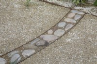 Mosaic pebble detail in path in The HomeAway Garden at RHS Malvern Spring Festival 2023