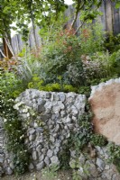 The Samaritans Listening Garden. Designer: Darren Hawkes. Chelsea Flower Show 2023. A garden of salvaged materials. Summer. May.