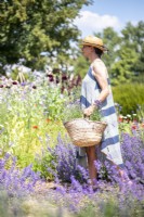 Woman carrying a basket full of Lavender