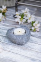 Tealight in small stone tealight holder with blossom