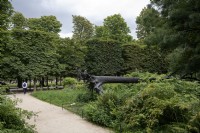 Paris France 
Jardin des Tuileries gardens in the city centre. 
Art imitating life. 
Sculpture of a fallen tree. L'Arbre des voyelles by Giuseppe Penone.