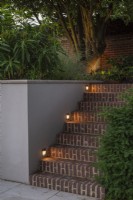 Recessed lighting for brick steps in evening 
