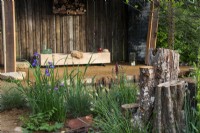 Tree stumps as wildlife habitat - The Wildlife Trusts: Wilder Spaces show garden - RHS Malvern Spring Festival 2023 - Designer Jamie Langlands - Best in Show