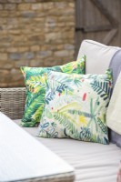 Patterned cushions on a garden sofa