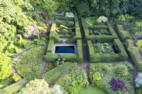 Wide view over the garden with Yew hedges containing several other garden rooms. September. Image taken with drone. 