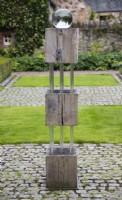Sculpture of wooden blocks and Perspex rods mounted with glass globe by Robert Dalrymple in the Upper Courtyard. August.