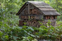 Bug hotel in the woodland garden at The Picton Garden, Herefordshire