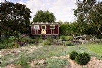 1950s showman's caravan with gravel garden covered with creeping thyme at Terstan in September