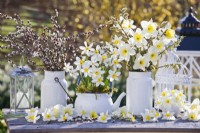 White themed arrangement with daffodils and pussy willow.