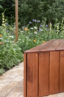 A contemporary bench made from repurposed timber cladding on The Sadler's Wells East Garden, designed by Alexa Ryan-Mills - All About Plants Gardens - RHS Chelsea Flower Show 2023