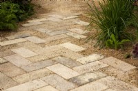 Brick path made from crushed terracotta pots on The Nurture Landscapes Garden - designer Sarah Price - RHS Chelsea Flower Show 2023