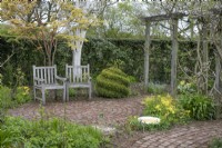 Seating area in A Plantsman's Garden at Barnsdale Gardens, April