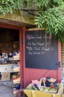 Shop selling produce and flowers in the walled garden at Parham House in West Sussex in September