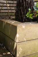 A wooden raised bed.