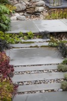Pathway in 'A Glimpse of South East Asia' garden at BBC Gardeners World Live 2019, June
