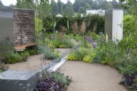 Mixed planting, rill and seating area in the Cruse Bereavement Care: A Time for Everything Show Garden - RHS Chatsworth Flower Show 2017 