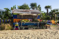 Colourful beach hut with fresh fruit display