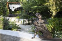 Sculptor Andrew Litten bronze Sculpture - Listening overlooks the contemporary garden designed by Darren Hawkes 