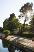 Borde Hill Garden's formal Italian garden with pond and mature trees in September