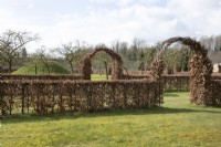 Beech hedge with arches at Chippenham Park Gardens, March
