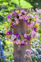 Wreath made of mostly pink flowers including Echinacea, Rosa, Fennel, Monarda and Veronicastrum.