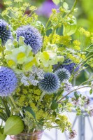 Yellow - blue themed bouquet consisting of Echinops, Snapdragon, Fennel, Achillea and Physalis.