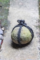 Round stone on path tied with string to indicate No Entry. This is called Tome ishi. 