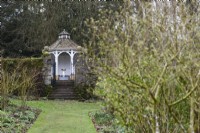 Gazebo viewed from the walled garden at Cerney House Gardens in winter