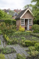 Brick summerhouse in Plot 16 at Hill Close Gardens, May