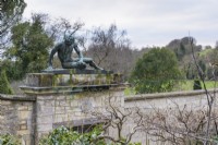 Statue of the Dying Gaul above the entrance into the walled garden at Iford Manor in January