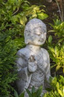 A Buddha statue in The Thai Garden at The Manor, Little Compton.