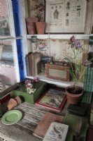 Potting shed bench with gardening books and guides on how to garden