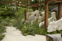 RHS Chelsea Flower Show 2023 - Concrete panels suspended in a steel pergola - Samaritans' Listening Garden - Designed by Darren Hawkes