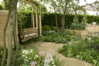 RHS Chelsea Flower Show 2023 - Swing overlooking the London Square Community Garden Designed by James Smith