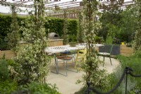 RHS Chelsea Flower Show 2023 - Trellis over the dining area in the London Square Community Garden designed by James Smith
