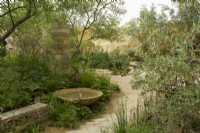 RHS Chelsea Flower Show 2023  - Pathway through mixed borders - The Nurture Landscapes  Garden designed by Sarah Price Gold