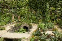 RHS Chelsea Flower Show 2023 - Stream and bridge in The Savills Garden designed by Mark Gregory - Silver Gilt