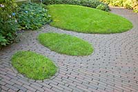 Grass islands in the pavement 