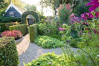 Cottage and kitchen garden in the evening light 