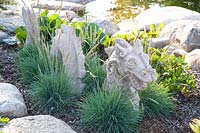 Dragon as garden decoration, Festuca glauca 