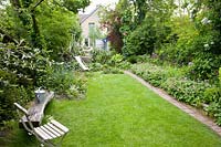 Narrow garden with lawn and path 