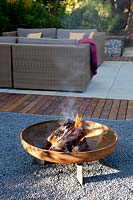 Fire bowl in modern garden 