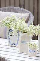 Antique storage jars with cow parsley 