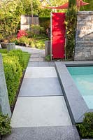 Wall panel and water basin with path, concrete block as wall 