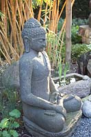 Buddha statue and bamboo, Phyllostachys vivax 