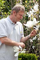 Owner, Reto Eisenhut with Magnolia Lotus 