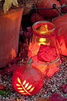 Pumpkin lantern with floral pattern and lantern with leaves 