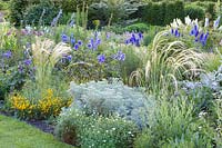 Heron feather grass, Stipa barbata, Stipa pulcherrima, Santolina rosmarinifolia, Artemisia Powis Castle, Delphinium, Geranium 
