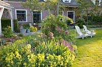 Seating area rural garden, Alchemilla mollis, Salvia nemorosa East Frisia 